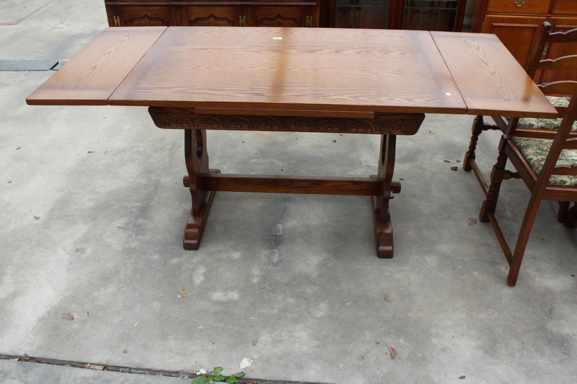 AN OAK JAYCEE REFECTORY STYLE DRAW-LEAF DINING TABLE, 48 X 32 INCHES (LEAVES 12 INCHES EACH)