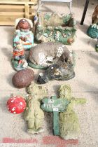 AN ASSORTMENT OF PAINTED CONCRETE GARDEN FIGURES