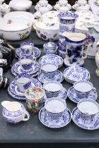 A LARGE QUANTITY OF ORIENTAL STYLE BLUE AND WHITE TO INCLUDE CUPS,SAUCERS,SIDE PLATES PLUS A JUG AND