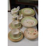 A PART DINNER SERVICE TO INCLUDE PLATES, LARGE BOWLS, DESSERT BOWLS, A TEAPOT, SUGAR BOWL, CREAM