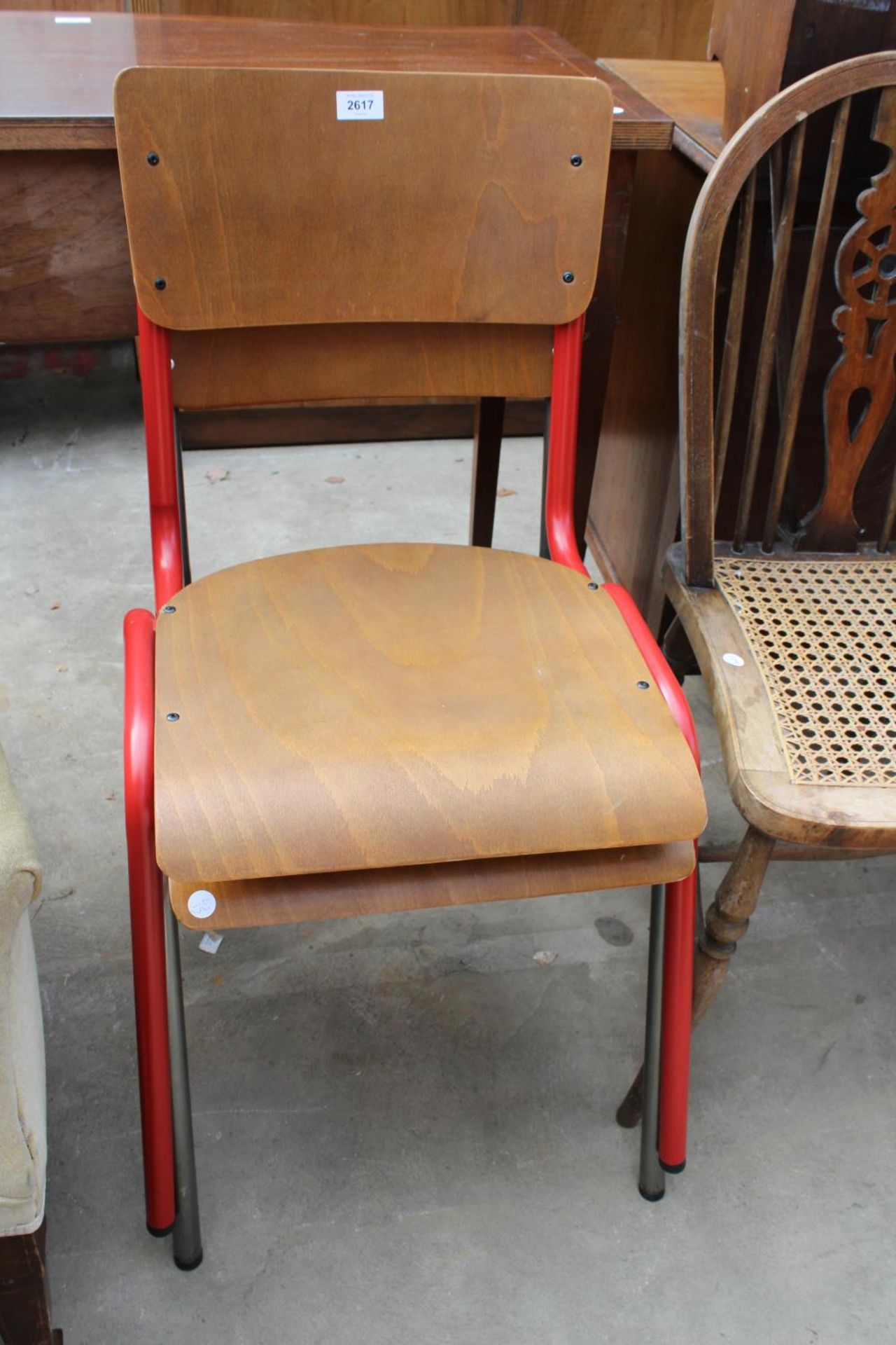 A PAIR OF TUBULAR METAL BENTWOOD STACKING CHAIRS