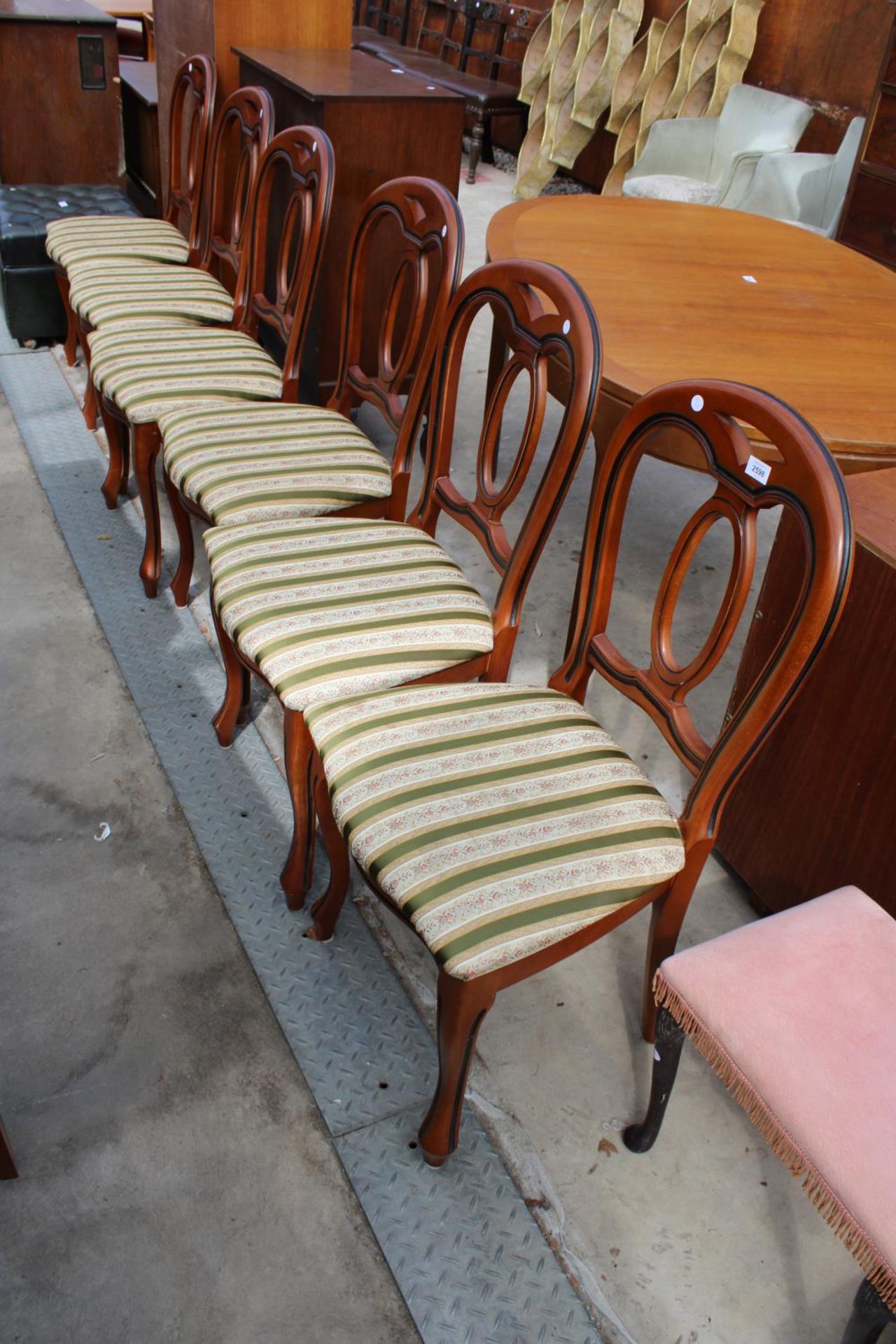 A SET OF SIX VICTORIAN STYLE HARDWOOD DINING CHAIRS