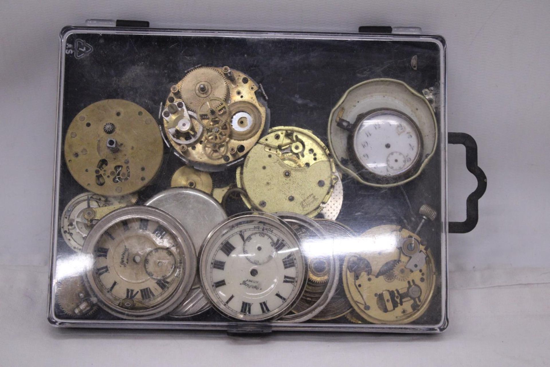 A QUANTITY OF WATCH PARTS IN CASE