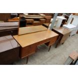 A MCINTOSH RETRO TEAK DRESSING TABLE ENCLOSING FIVE DRAWERS, 55.5" WIDE ON TAPERING LEGS