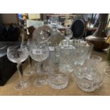 A QUANTITY OF GLASSWARE TO INCLUDE DECANTERS, BOWLS, WINE GLASSES ETC