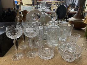 A QUANTITY OF GLASSWARE TO INCLUDE DECANTERS, BOWLS, WINE GLASSES ETC