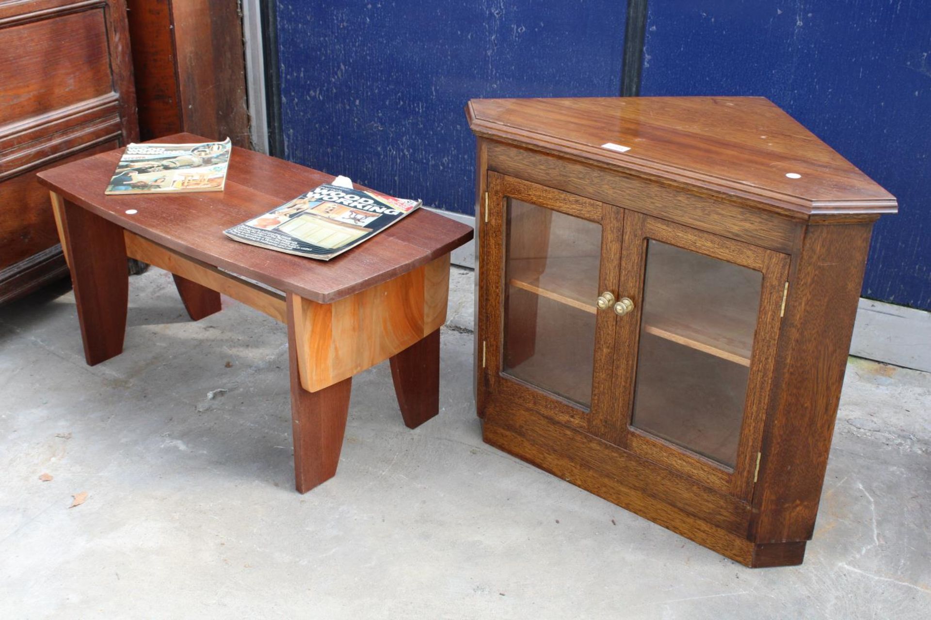 A GORDON WARR CONTRASTING HARDWOOD COFFEE TABLE AND AN OAK CORNER CABINET