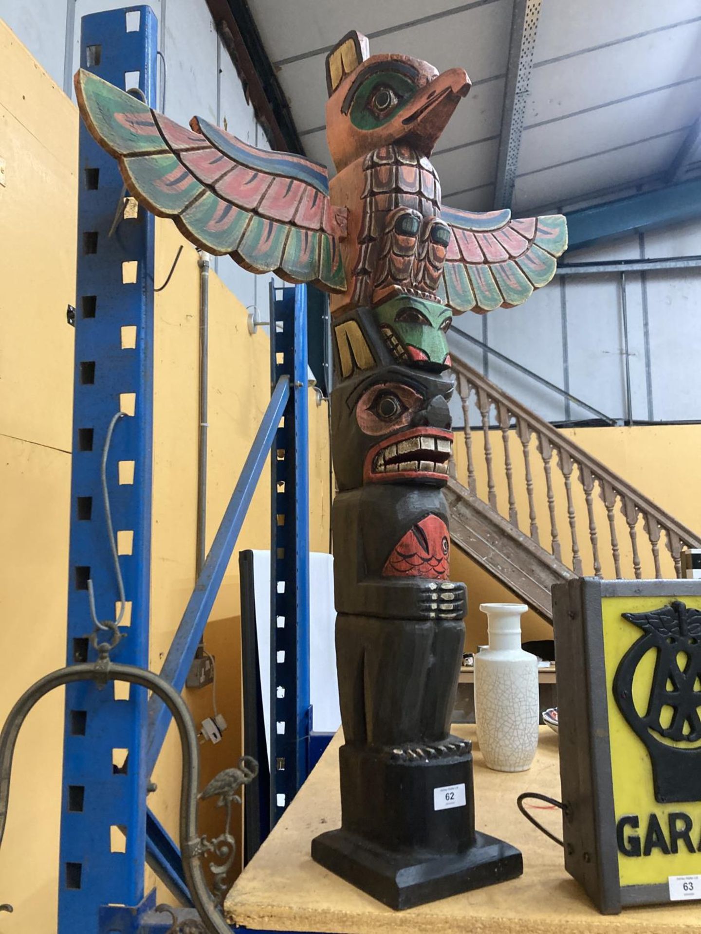 A CARVED WOODEN TOTEM POLE