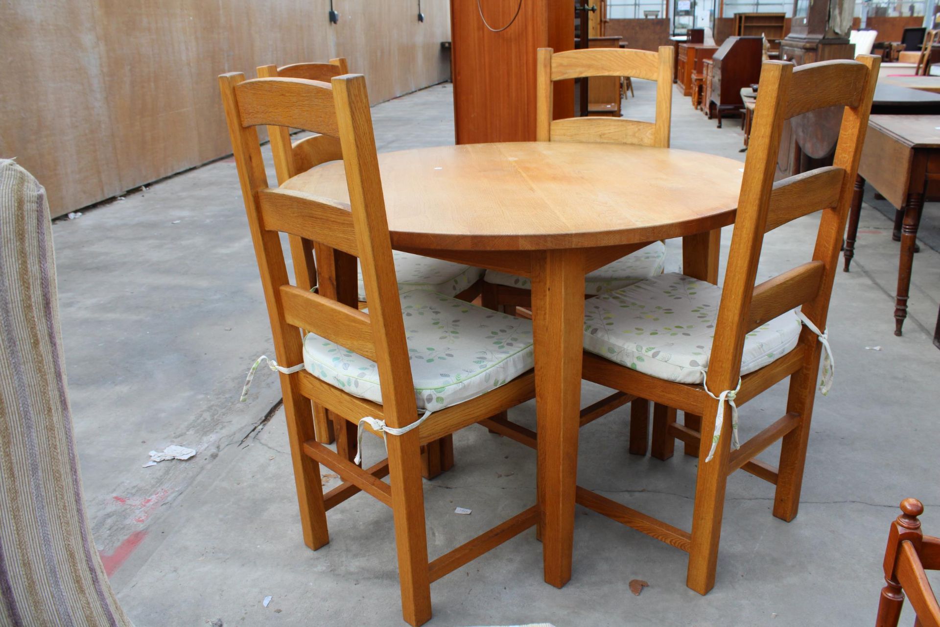 A CIRCULAR OAK DINING TABLE, WITH FOUR OAK LADDER BACK DINING CHAIRS WITH RUSH SEATS, DIAMETER 111CM - Image 2 of 3