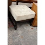 A MODERN UPHOLSTERED STOOL, 21" SQUARE ON TURNED LEGS