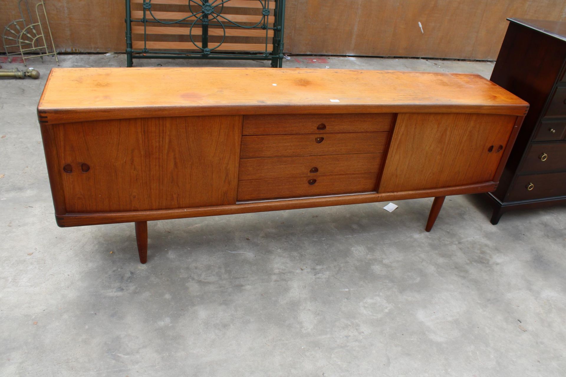 A BRAMIN OF DENMARK, MID CENTURY DANISH TEAK SIDEBOARD ENCLOSING TWO CUPBOARDS AND FOUR LONG