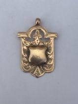 A HALLMARKED BIRMINGHAM 9CT GOLD VINTAGE SPORTING FOB, MAKERS T.S, WEIGHT 3.5 G