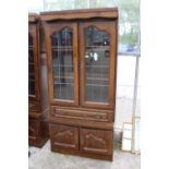A MODERN OAK CABINET WITH GLAZED AND LEADED UPPER PORTION, 37" WIDE