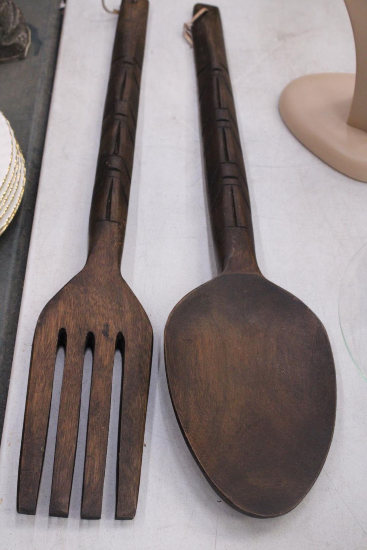 TWO LARGE WOODEN WALL DECORATIONS OF A FORK AND SPOON