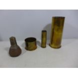 A WORLD WAR I SHELL FUSE (INERT), AND THREE SHELL CASES