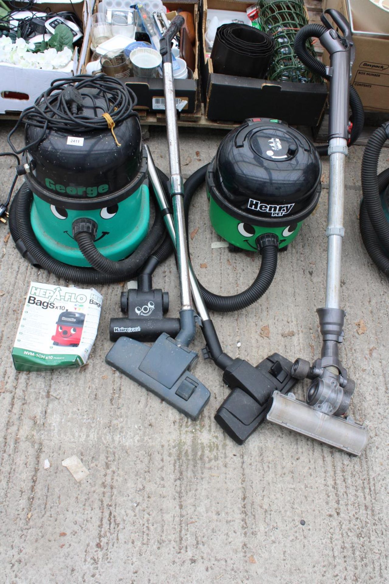 A HENRY PET VACUUM AND A FURTHER GEORGE VACUUM CLEANER