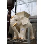 A DECORATIVE CERAMIC ELEPHANT JARDINAIRE STAND