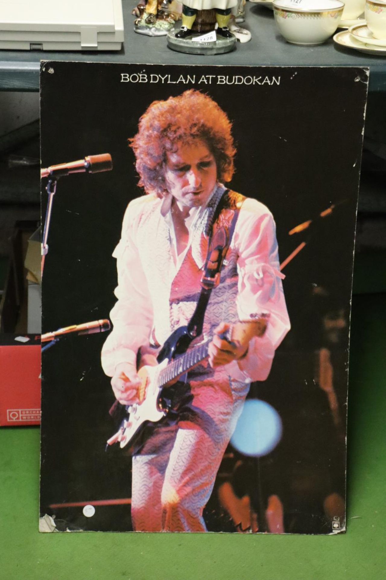 A PHOTOGRAPHIC PRINT ON BOARD OF BOB DYLAN AT BUDOKAN, 50CM X 76CM