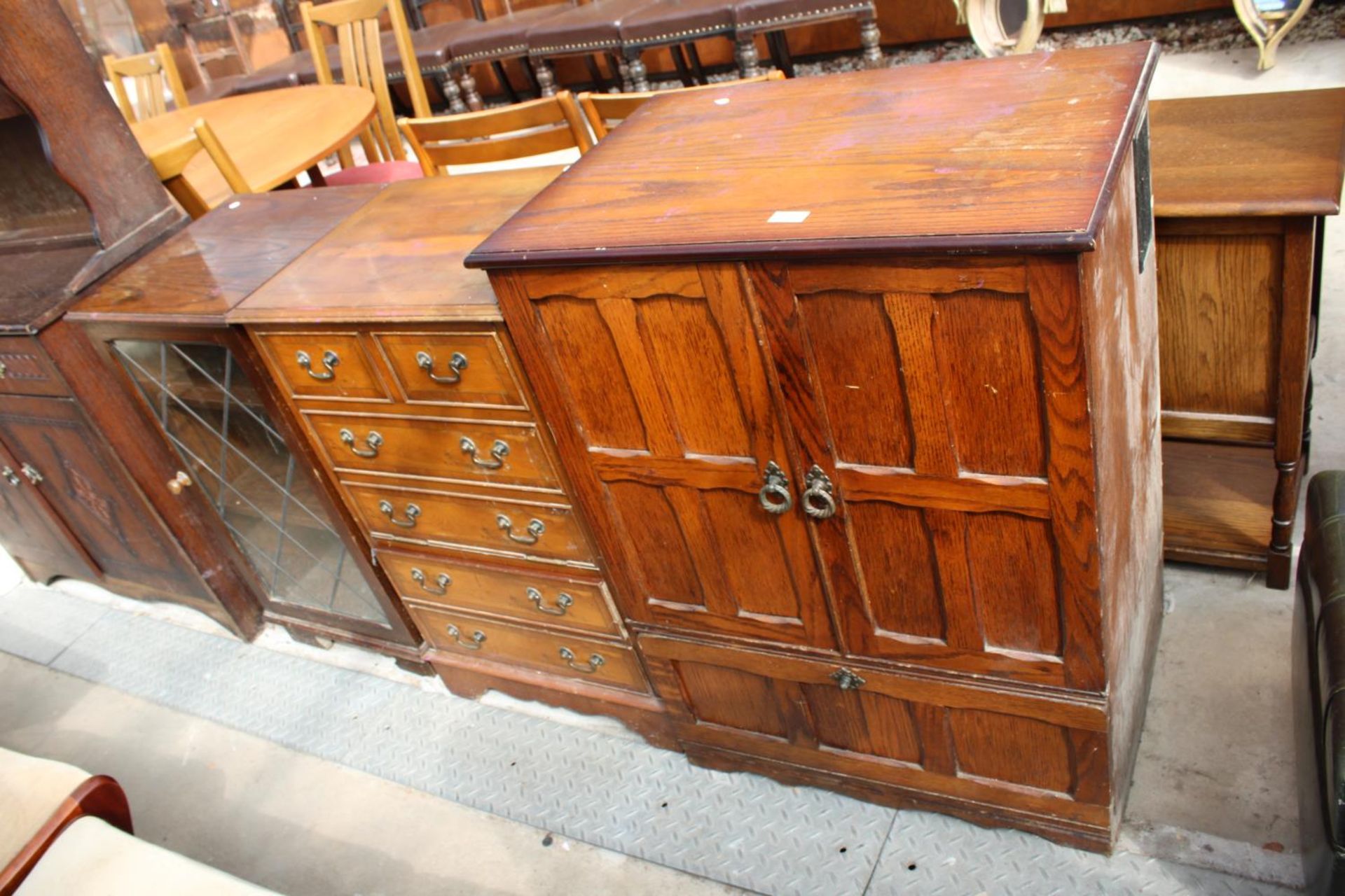 A MODERN OAK T.V. CABINET, YEW WOOD HI-FI CABINET AND OAK DITTO