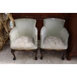 A PAIR OF MODERN UPHOSTERED TUB CHAIRS ON FRONT CABRIOLE LEGS WITH BALL AND CLAW FEET