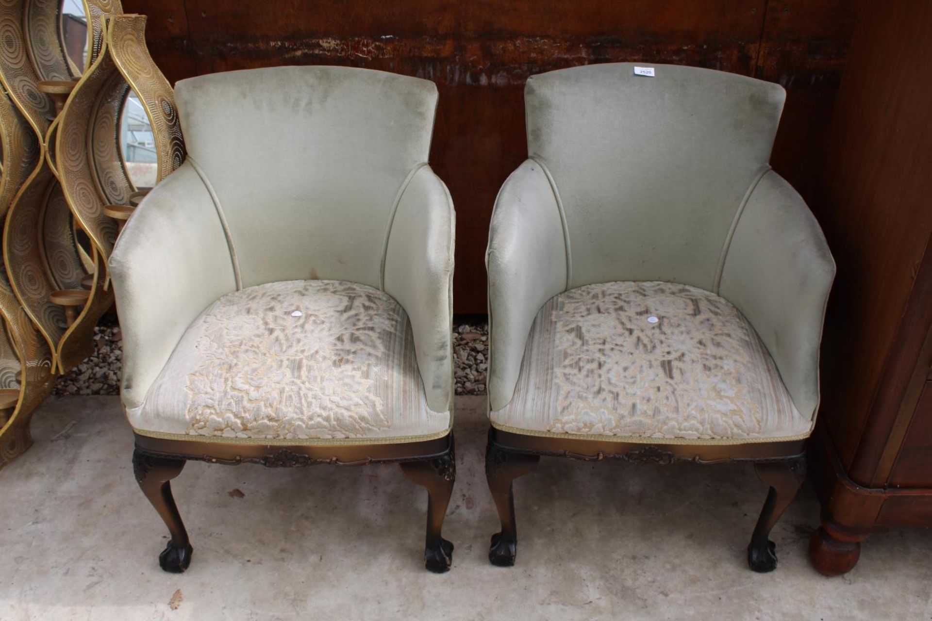 A PAIR OF MODERN UPHOSTERED TUB CHAIRS ON FRONT CABRIOLE LEGS WITH BALL AND CLAW FEET