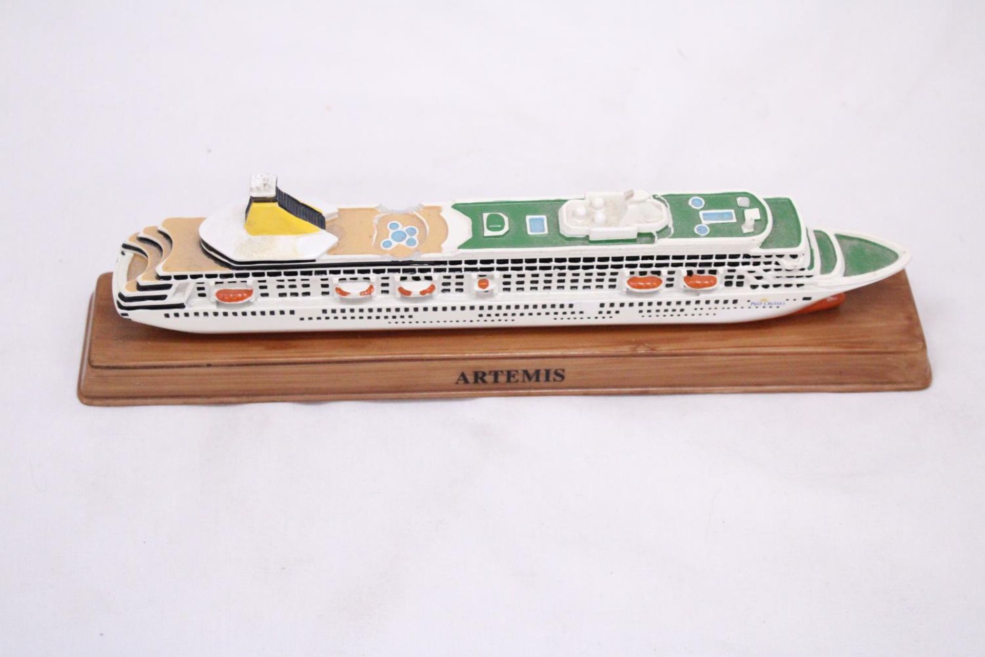 A HEAVY SOLID OCEAN LINER ON WOODEN STAND (ARTEMIS), LENGTH 26CM, HEIGHT 6CM