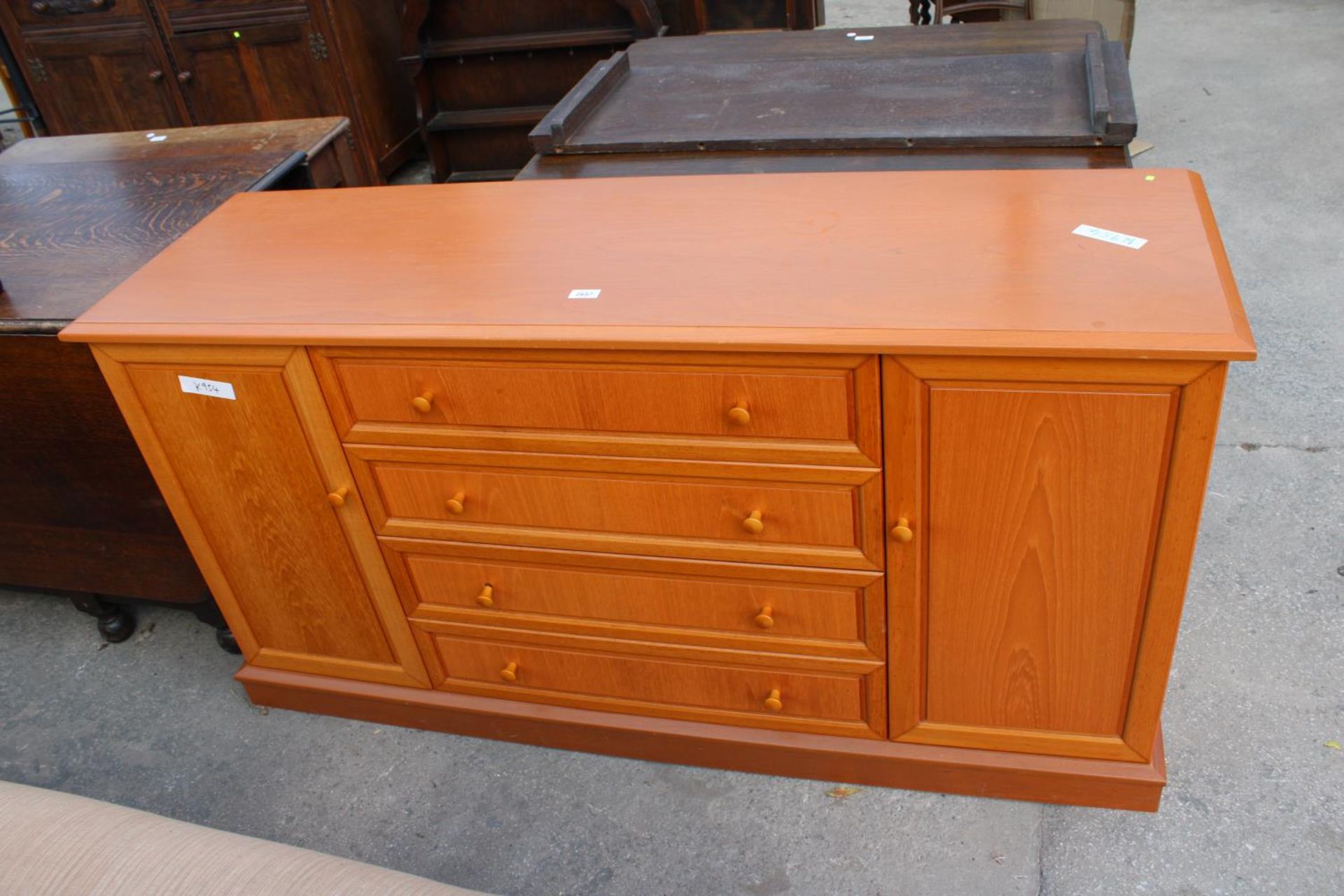 A MODERN G PLAN SIDEBOARD ENCLOSING FOUR DRAWERS AND TWO CUPBOARDS, 61" WIDE