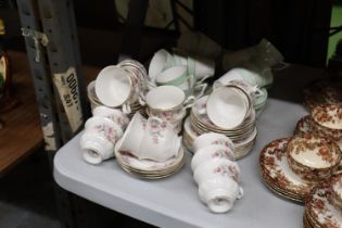 A LARGE QUANTITY OF COLCLOUGH AND GAINSBOROUGH CUPS, SAUCERS AND SIDE PLATES