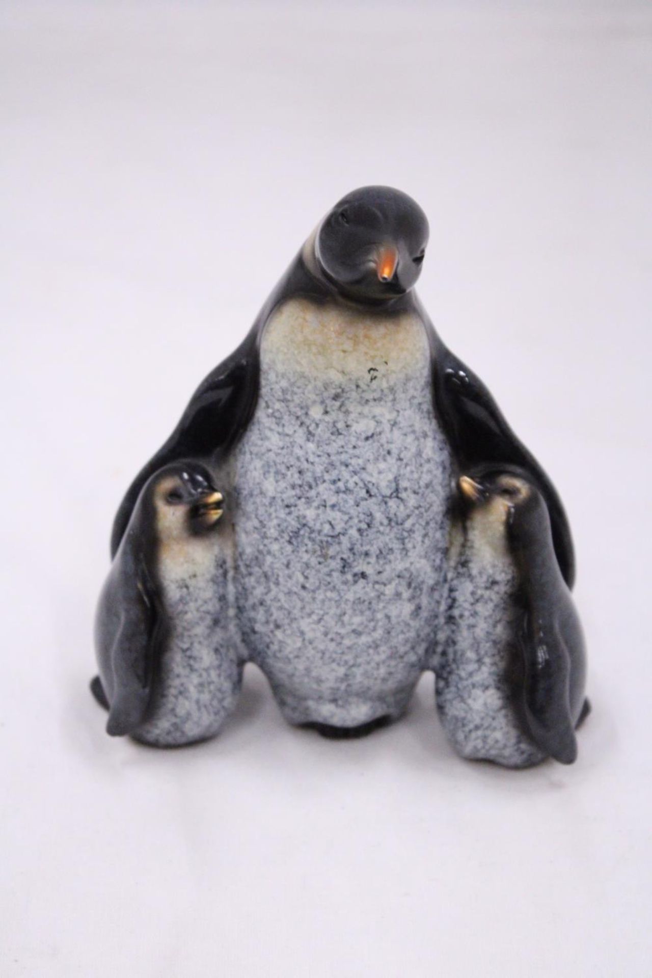 A STUDIO ART PENGUIN FIGURE "THE FAMILY"