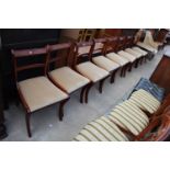 A SET OF 8 REGENCY STYLE MAHOGANY AND BRASS INLAY DINING CHAIRS