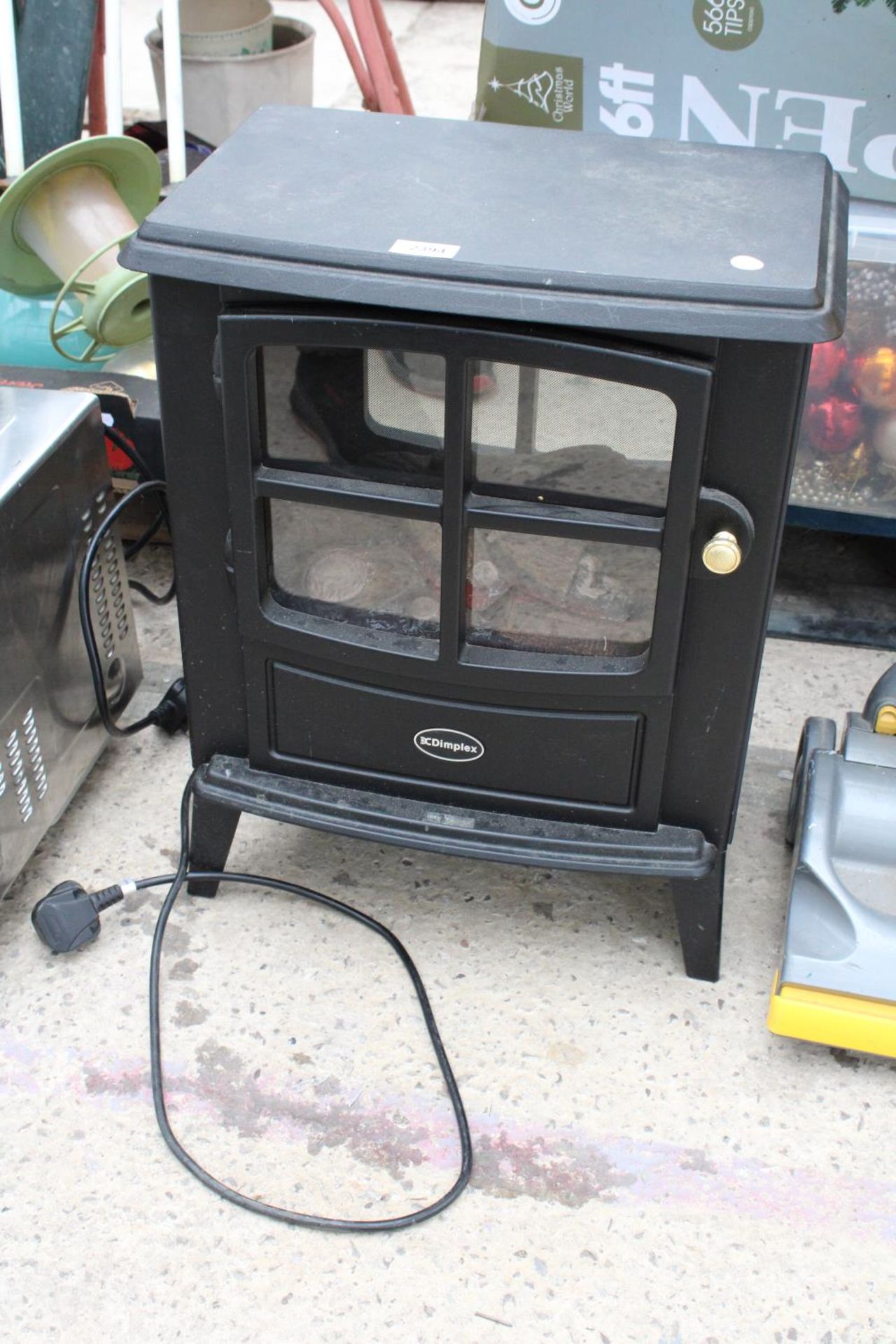 A DIMPLEX ELECTRIC FIRE IN THE FORM OF A LOG BURNER