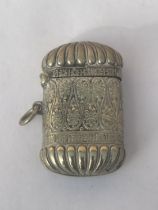 A DECORATIVE WHITE METAL VESTA CASE