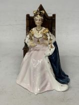 A ROYAL DOULTON FIGURE OF THE QUEEN SEATED