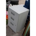 A THREE DRAWER METAL FILING CABINET