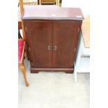 A MAHOGANY AND CROSSBANDED TWO DOOR CABINET AND SET OF OPEN PINE SHELVES