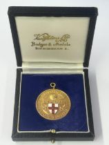 A HALLMARKED 9 CARAT GOLD & ENAMEL FOOTBALL LEAGUE CANON DIVISION 3 LEAGUE WINNERS MEDAL 1983-1984