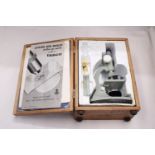A VINTAGE, BOXED, TASCO MICROSCOPE WITH INSTRUCTIONS