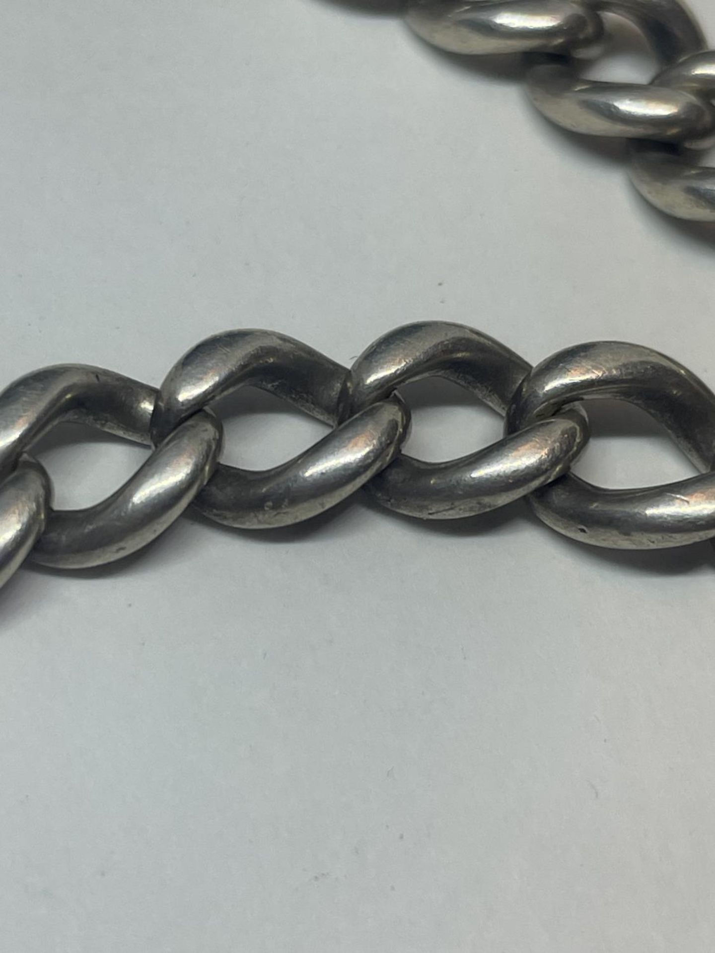 A SILVER DOUBLE ALBERT WATCH CHAIN WITH THREE FOBS AND A KEY - Image 4 of 4