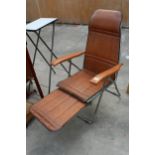 A RETRO TUBULAR CHROME AND FAUX LEATHER LOUNGER