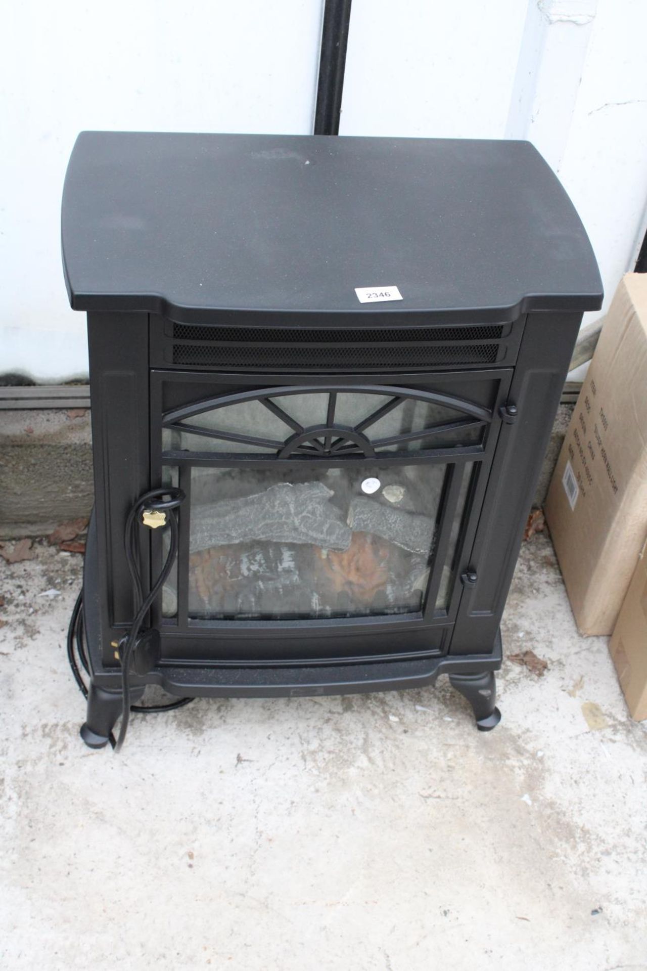 AN ELECTRIC FIRE IN THE FORM OF A LOG BURNER