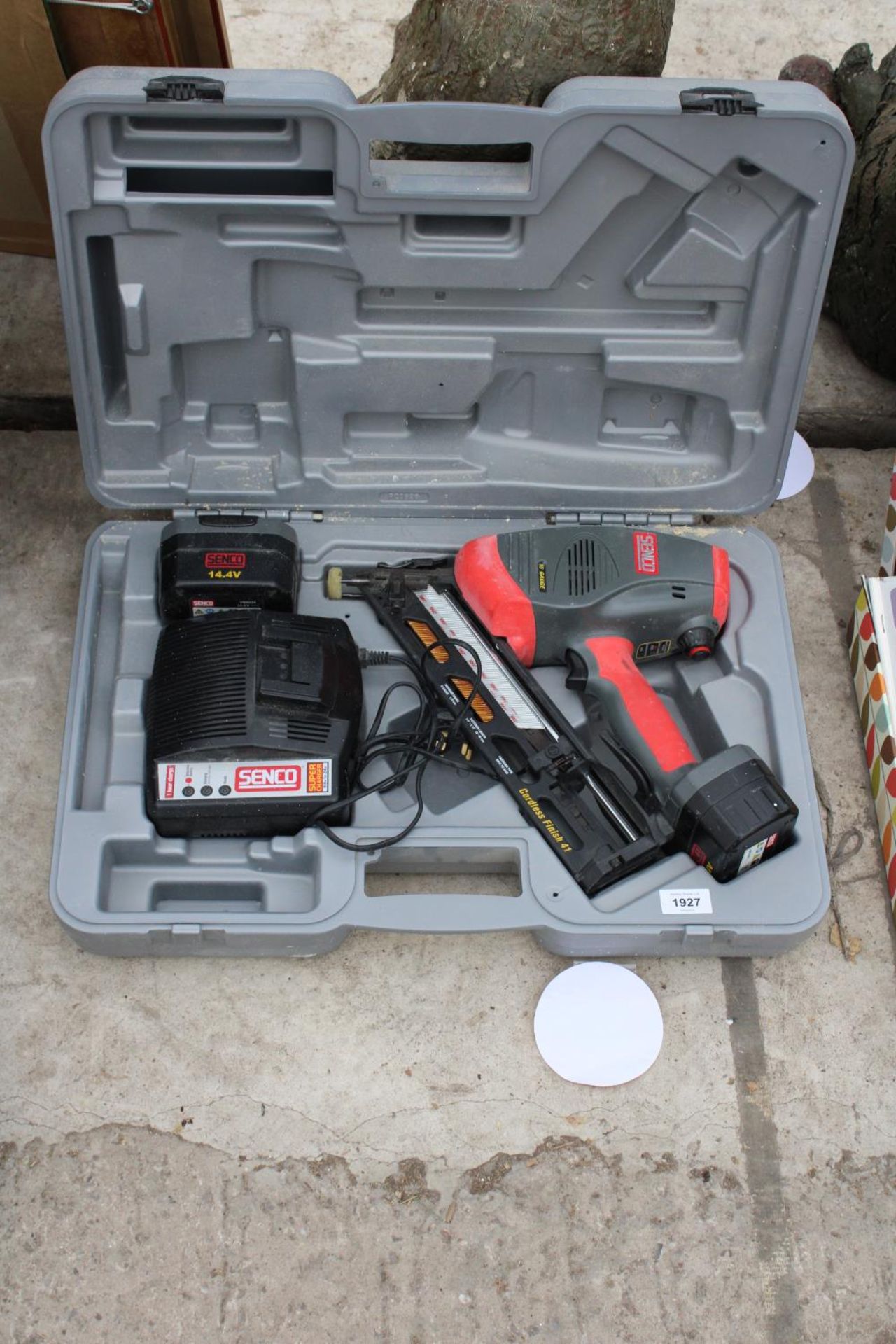 A CASED SENCO BATTERY POWERED NAIL GUN