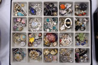 A QUANTITY OF COSTUME JEWELLERY IN DISPLAY CASE