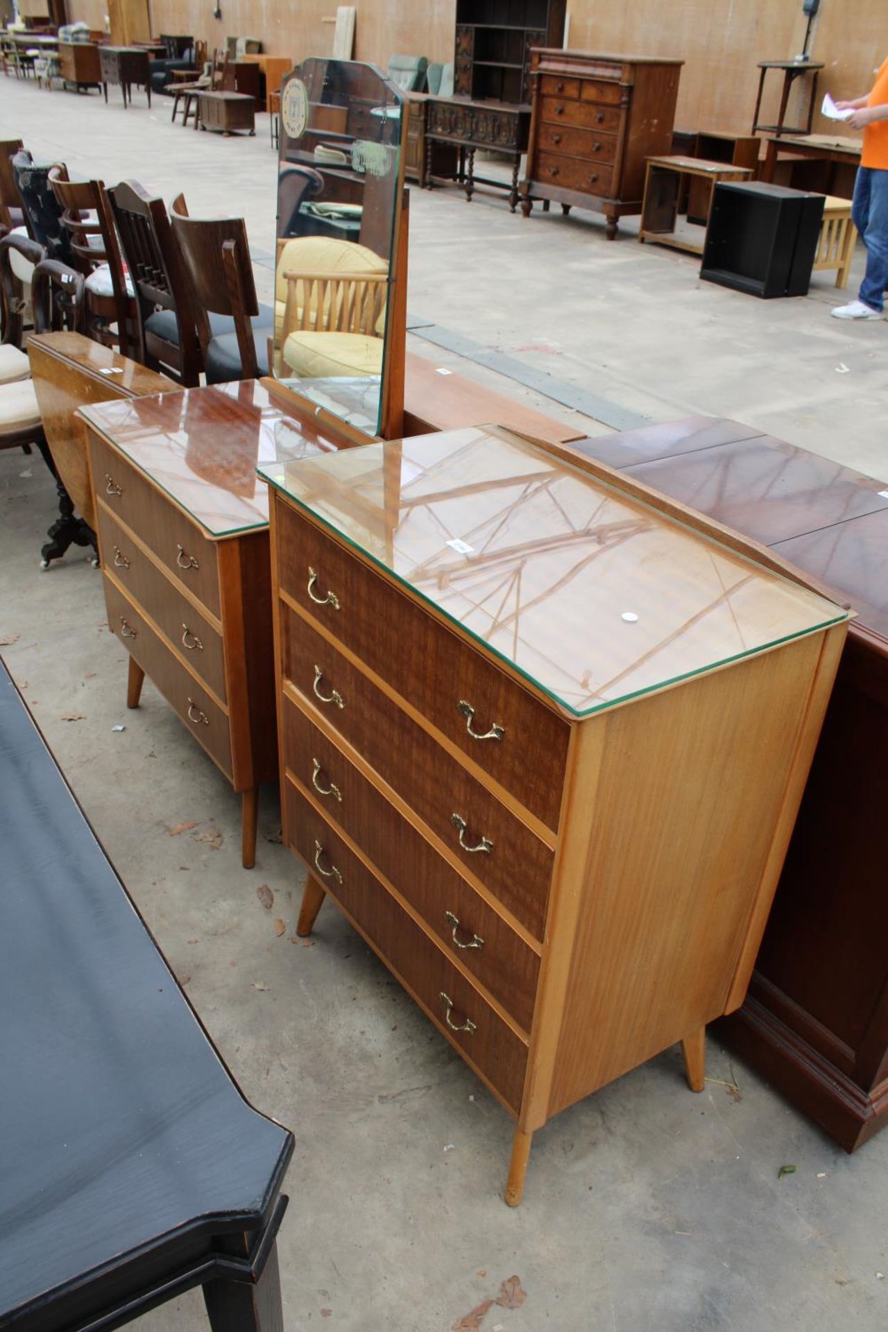 A MID 20TH CENTURY TEAK CHEST OF FOUR DRAWERS AND A MATCHING DRESSING CHEST (30" WIDE EACH)