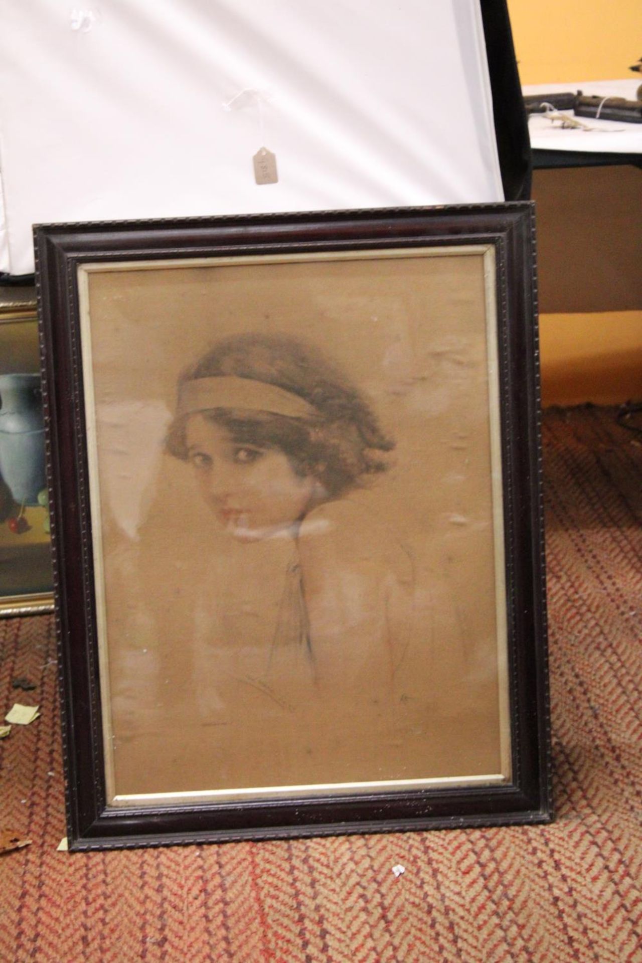 A LARGE PRINT OF A YOUNG LADY, 60CM X 76CM