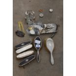 AN ASSORTMENT OF ITEMS TO INCLUDE HALLMARKED SILVER DRESSING TABLE BRUSHES, A CRUET SET AND SCISSORS