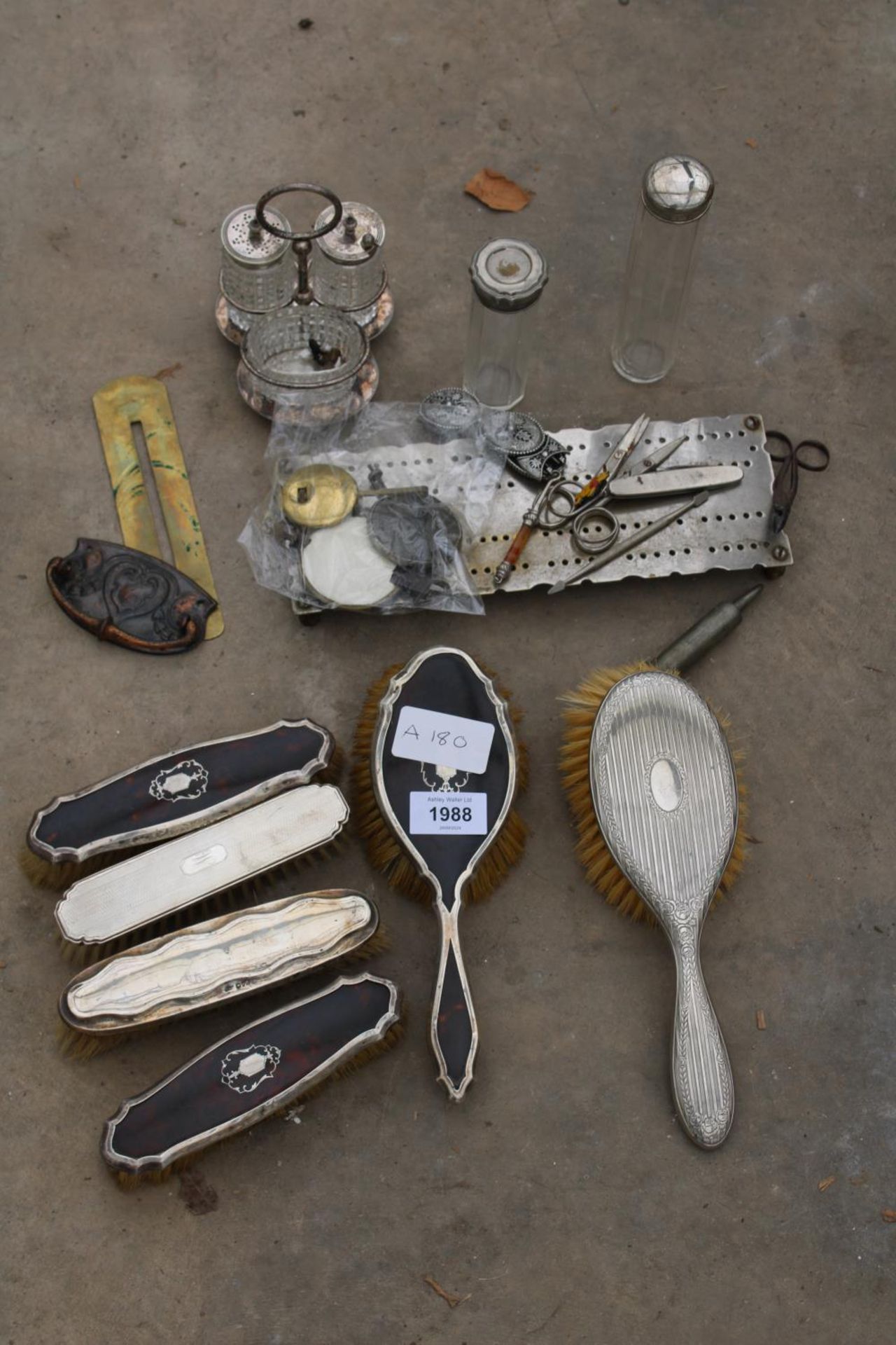 AN ASSORTMENT OF ITEMS TO INCLUDE HALLMARKED SILVER DRESSING TABLE BRUSHES, A CRUET SET AND SCISSORS