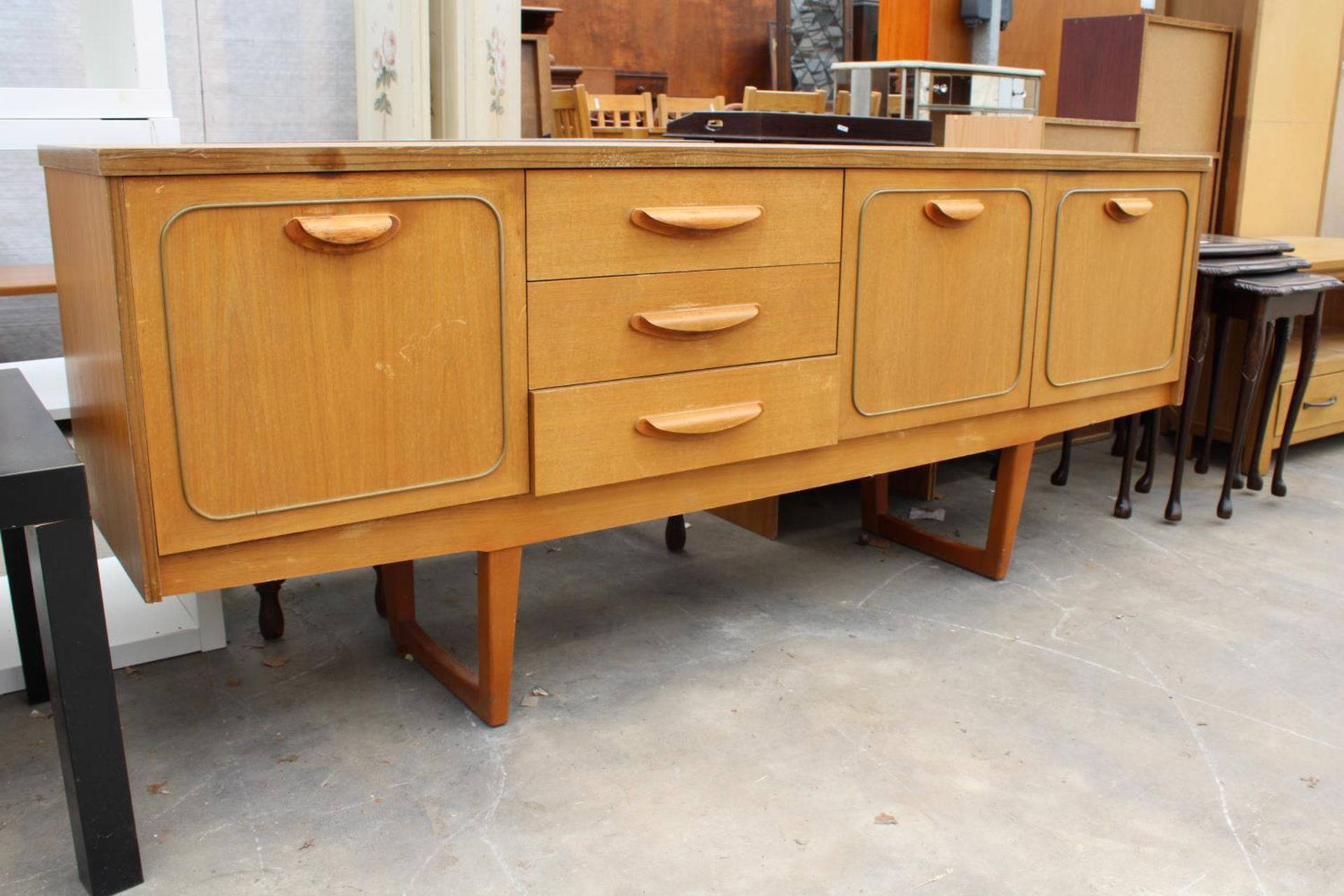 A RETRO TEAK SIDEBOARD ENCLOSING THREE DRAWERS AND THREE CUPBOARDS, 72" WIDE - Image 2 of 3