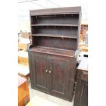 A LATE VICTORIAN PINE KITCHEN DRESSER WITH 2 CUPBOARDS TO BASE AND PLATE RACK, 43" WIDE