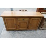 A MODERN OAK SIDEBOARD ENCLOSING THREE PANELLED DOORS AND SINGLE DRAWER, 68"