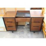 A RETRO STAG TWIN PEDESTAL DESK/DRESSING TABLE ENCLOSING SEVEN DRAWERS 48" WIDE